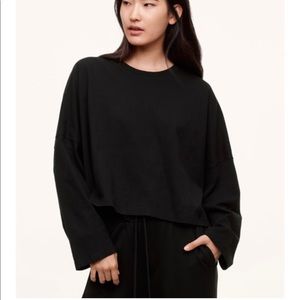 The group babaton black 3/4 sleeve crop tee. Wide crop fit.  Size med